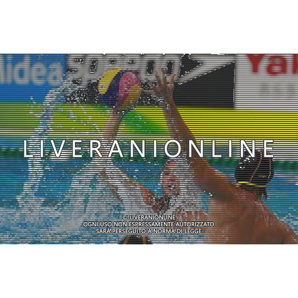 (110728) -- SHANGHAI, July 28, 2011 () -- Erik Marcin Bukowski (front) of Germany competes in the semifinal 5th-8th match of men\'s water polo event between the United States and Germany at the 14th FINA World Championships in Shanghai, east China, July 28, 2011. The United States won the match 9-8.(/Pei Xin) (sqq)