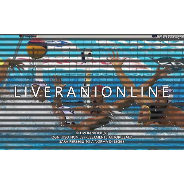 (110728) -- SHANGHAI, July 28, 2011 () -- Players of the United States defend in the semifinal 5th-8th match of men\'s water polo event between the United States and Germany at the 14th FINA World Championships in Shanghai, east China, July 28, 2011. The United States won the match 9-8.(/Pei Xin) (sqq)