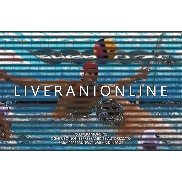 (110728) -- SHANGHAI, July 28, 2011 () -- Marc Torsten Politze of Germany (blue) shoots in the semifinal 5th-8th match of men\'s water polo event between the United States and Germany at the 14th FINA World Championships in Shanghai, east China, July 28, 2011. The United States won the match 9-8.(/Pei Xin) (sqq)