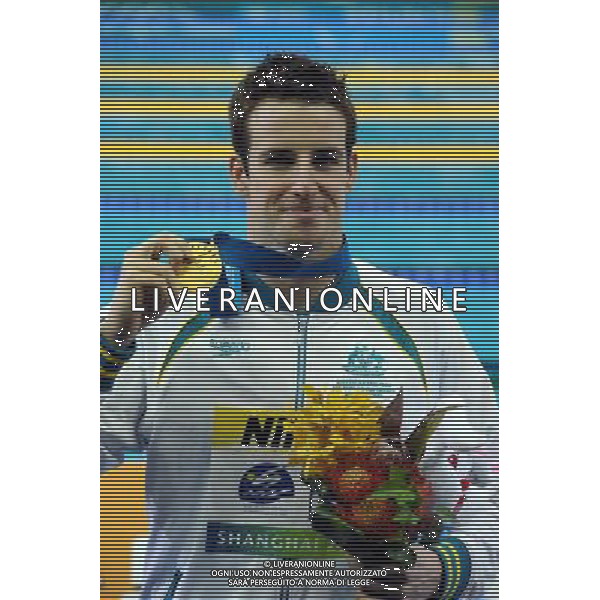 (110728) -- SHANGHAI, July 28, 2011 () -- James Magnussen of Australia poses in the awarding ceremony of men\'s 100m freestyle swimming event at the 14th FINA World Championships in Shanghai, east China, July 28, 2011. James Magnussen claimed the title with 47.63. (/Yang Lei) (sqq)