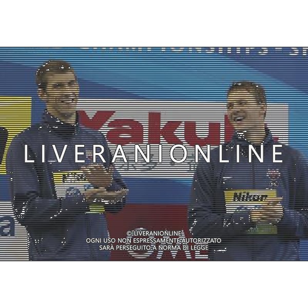 (110728) -- SHANGHAI, July 28, 2011 () -- Ryan Lochte (R) and Michael Phelps of the United States attend the awarding ceremony of men\'s 200m individual medley swimming event at the 14th FINA World Championships in Shanghai, east China, July 28, 2011. Ryan Lochte claimed the title and set a new world record with 1:54.00. Michael Phelps won the silver medal with 1:54.16. (/Fan Jun) (sqq)