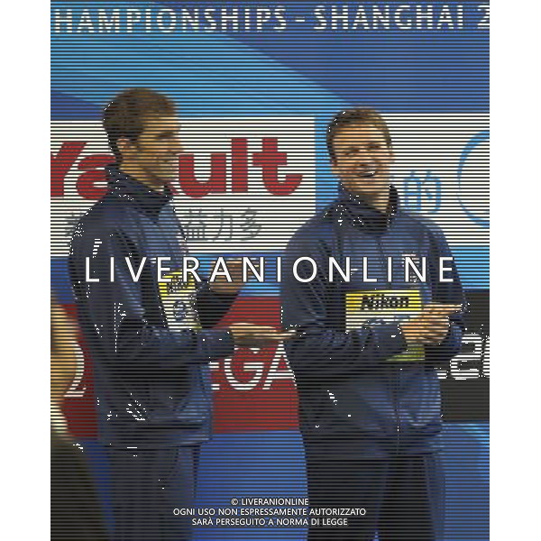 (110728) -- SHANGHAI, July 28, 2011 () -- Ryan Lochte (R) and Michael Phelps of the United States celebrate in the awarding ceremony of men\'s 200m individual medley swimming event at the 14th FINA World Championships in Shanghai, east China, July 28, 2011. Ryan Lochte claimed the title and set a new world record with 1:54.00. Michael Phelps won the silver medal with 1:54.16. (/Yang Lei) (sqq)
