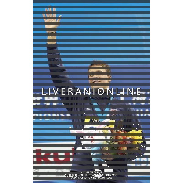 (110728) -- SHANGHAI, July 28, 2011 () -- Ryan Lochte of the United States poses in the awarding ceremony of men\'s 200m individual medley swimming event at the 14th FINA World Championships in Shanghai, east China, July 28, 2011. Ryan Lochte claimed the title and set a new world record with 1:54.00. (/Fan Jun)(sqq)