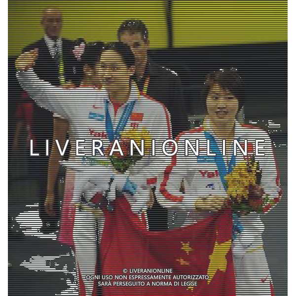 (110728) -- SHANGHAI, July 28, 2011 () -- Jiao Liuyang (R) and Liu Zige of China greet the public after the awarding ceremony of women\'s 200m butterfly swimming event at the 14th FINA World Championships in Shanghai, east China, July 28, 2011. Jiao Liuyang of China claimed the title with 2:05.55. Liu Zige got the bronze medal with 2:05.90. (/Yang Zongyou) (zgp)