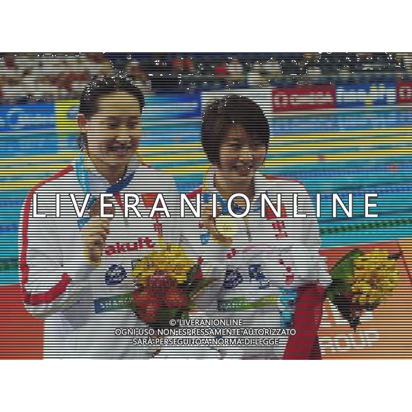 (110728) -- SHANGHAI, July 28, 2011 () -- Jiao Liuyang (R) and Liu Zige of China pose in the awarding ceremony of women\'s 200m butterfly swimming event at the 14th FINA World Championships in Shanghai, east China, July 28, 2011. Jiao Liuyang claimed the title with 2:05.55. Liu Zige got the bronze medal with 2:05.90. (/Yang Zongyou) (sqq)