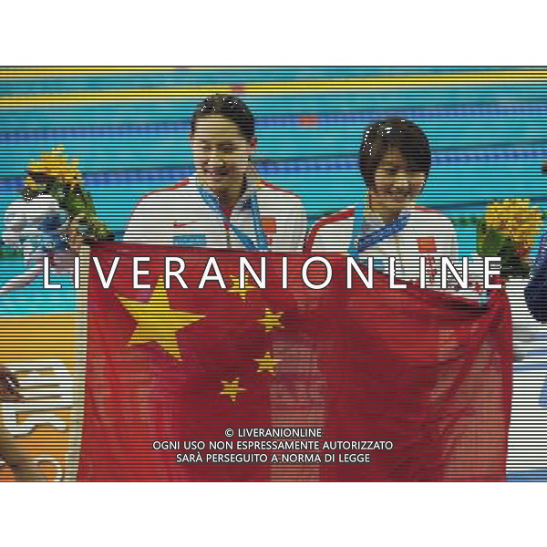 (110728) -- SHANGHAI, July 28, 2011 () -- Jiao Liuyang (R) and Liu Zige of China pose in the awarding ceremony of women\'s 200m butterfly swimming event at the 14th FINA World Championships in Shanghai, east China, July 28, 2011. Jiao Liuyang of China claimed the title with 2:05.55. Liu Zige got the bronze medal with 2:05.90. (/Yang Zongyou) (sqq)