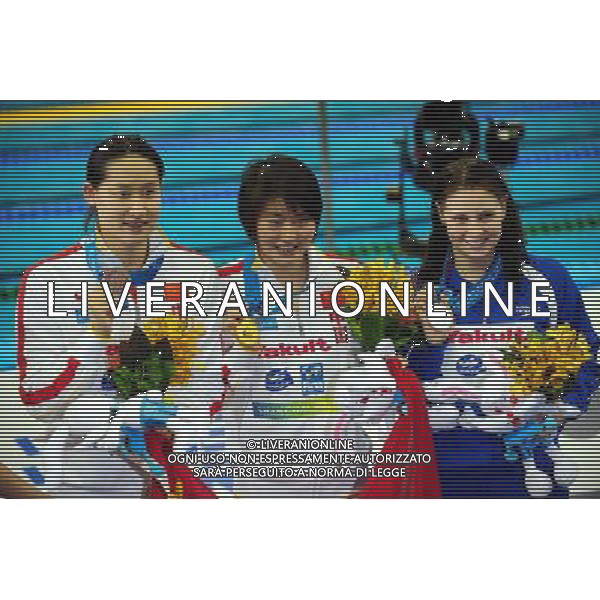 (110728) -- SHANGHAI, July 28, 2011 () -- Jiao Liuyang (C) and Liu Zige (L) of China, Ellen Gandy of Britain pose in the awarding ceremony of women\'s 200m butterfly swimming event at the 14th FINA World Championships in Shanghai, east China, July 28, 2011. Jiao Liuyang of China claimed the title with 2:05.55. Ellen Gandy won the silver medal with 2:05.59. Liu Zige got the bronze medal with 2:05.90. (/Yang Zongyou) (sqq)
