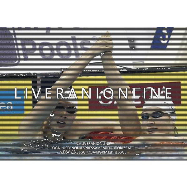 (110728) -- SHANGHAI, July 28, 2011 () -- Jiao Liuyang (L) and Liu Zige of China celebrate after the final of women\'s 200m butterfly swimming event at the 14th FINA World Championships in Shanghai, east China, July 28, 2011. Jiao Liuyang of China claimed the title with 2:05.55. Liu Zige won the bronze medal with 2:05.90. (/Ren Long) (zgp)