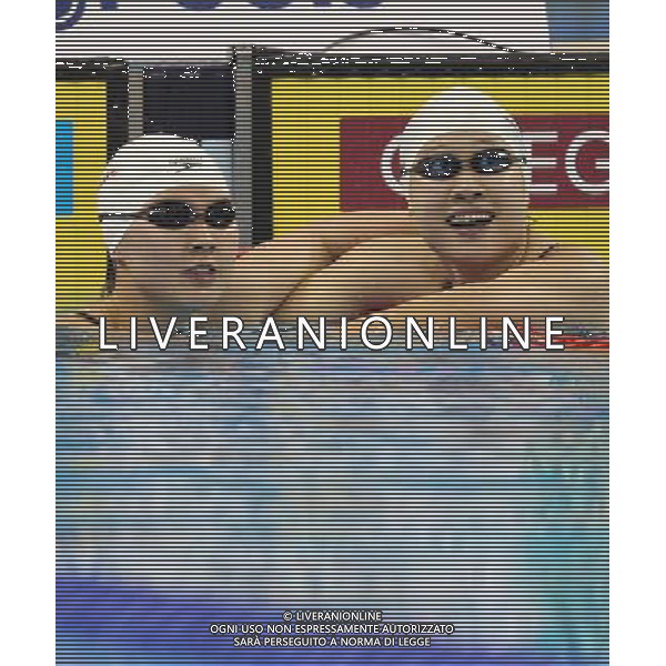 (110728) -- SHANGHAI, July 28, 2011 () -- Jiao Liuyang (L) and Liu Zige of China react after the final of women\'s 200m butterfly swimming event at the 14th FINA World Championships in Shanghai, east China, July 28, 2011. Jiao Liuyang of China claimed the title with 2:05.55. Liu Zige won the bronze medal with 2:05.90. (/Fan Jun) (zgp)