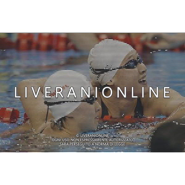 (110728) -- SHANGHAI, July 28, 2011 () -- Jiao Liuyang (L) and Liu Zige of China celebrate after the final of women\'s 200m butterfly swimming event at the 14th FINA World Championships in Shanghai, east China, July 28, 2011. Jiao Liuyang of China claimed the title with 2:05.55. Liu Zige won the bronze medal with 2:05.90. (/Fei Maohua) (zgp)