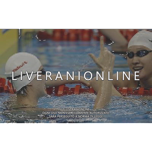(110728) -- SHANGHAI, July 28, 2011 () -- Jiao Liuyang (L) and Liu Zige of China celebrate after the final of women\'s 200m butterfly swimming event at the 14th FINA World Championships in Shanghai, east China, July 28, 2011. Jiao Liuyang of China claimed the title with 2:05.55. (/Fei Maohua) (zgp)