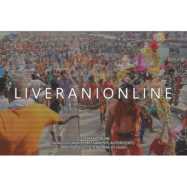 (110728) -- NEW DELHI, July 28, 2011 () -- Devotees of Hinduism carrying holy water walk on a street in Haridwar, Uttaranchal State of India, on July 27, 2011. Hindu pilgrims, also known as \'Kanwarias\', arrive barefoot from across the country and converge on the banks of the River Ganges annually to collect holy water (kanwar) from the River Ganges in Haridwar, Gangotri or Gaumukh in the northern Indian state of Uttaranchal, then pour the holy water in their hometown temples. This journey, completed on foot, is supposed to fulfil their wishes and endear them to Lord Shiva, the Hindu God of Destruction. All along the route to Haridwar, voluntary organizations put up food and medical stalls to cater to the pilgrims. (/Li Yigang) (lb)