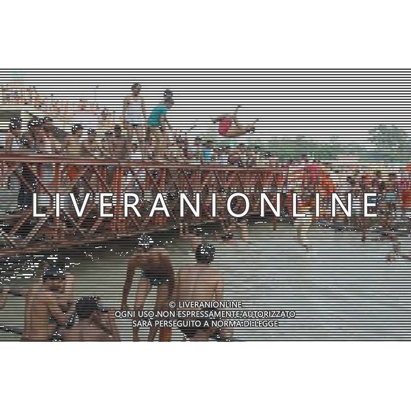 (110728) -- NEW DELHI, July 28, 2011 () -- Devotees of Hinduism dive into the River Ganges in Haridwar, Uttaranchal State of India, on July 27, 2011. Hindu pilgrims, also known as \'Kanwarias\', arrive barefoot from across the country and converge on the banks of the River Ganges annually to collect holy water (kanwar) from the River Ganges in Haridwar, Gangotri or Gaumukh in the northern Indian state of Uttaranchal, then pour the holy water in their hometown temples. This journey, completed on foot, is supposed to fulfil their wishes and endear them to Lord Shiva, the Hindu God of Destruction. All along the route to Haridwar, voluntary organizations put up food and medical stalls to cater to the pilgrims. (/Li Yigang) (lb)