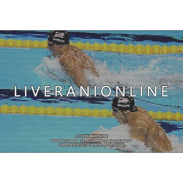 (110728) -- SHANGHAI, July 28, 2011 () -- Ryan Lochte (L) and Michael Phelps of the United States compete in the final of men\'s 200m individual medley swimming event at the 14th FINA World Championships in Shanghai, east China, July 28, 2011. Ryan Lochte claimed the title and set a new world record with 1:54.00. Michael Phelps won the silver medal with 1:54.16. (/Chen Fei)