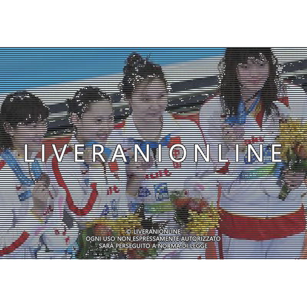 (110728) -- SHANGHAI, July 28, 2011 () -- Swimmers of China Pang Jiaying, Chen Qian, Liu Jing and Tang Yi (from L to R) pose in the awarding ceremony of women\'s 4x200m freestyle swimming event at the 14th FINA World Championships in Shanghai, east China, July 28, 2011. The Chinese team got the bronze medal with 7:47.66. (/Chen Fei) (sqq)