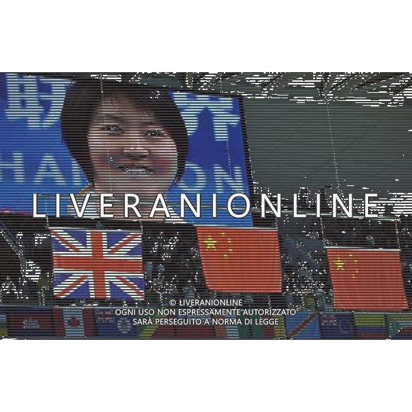 (110728) -- SHANGHAI, July 28, 2011 () -- The live screen shows Jiao Liuyang of China in the awarding ceremony of women\'s 200m butterfly swimming event at the 14th FINA World Championships in Shanghai, east China, July 28, 2011. Jiao Liuyang claimed the title with 2:05.55. (/Wang Yuguo) (sqq)