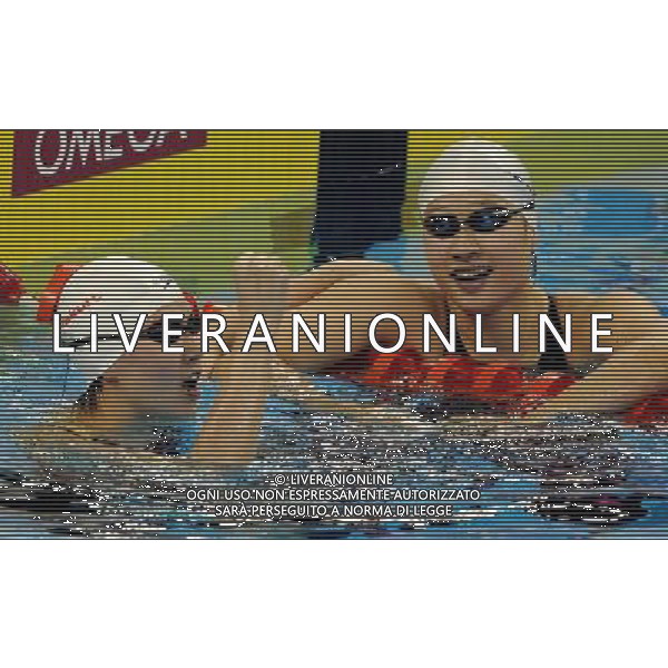 (110728) -- SHANGHAI, July 28, 2011 () -- Jiao Liuyang (L) and Liu Zige of China celebrate after the final of women\'s 200m butterfly swimming event at the 14th FINA World Championships in Shanghai, east China, July 28, 2011. Jiao Liuyang of China claimed the title with 2:05.55. Liu Zige won the bronze medal with 2:05.90. (/Wang Yuguo) (zgp)