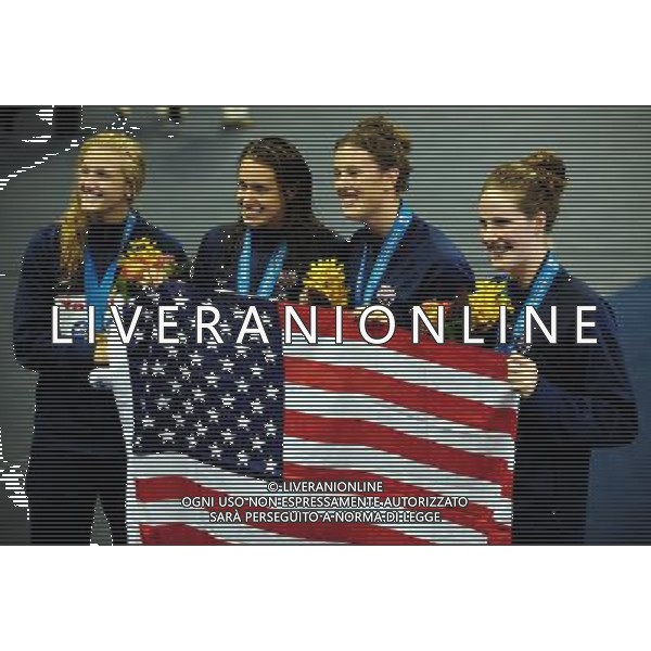 (110728) -- SHANGHAI, July 28, 2011 () -- Swimmers of the United States pose after the awarding ceremony of women\'s 4x200m freestyle swimming event at the 14th FINA World Championships in Shanghai, east China, July 28, 2011. The team of the United States claimed the title with 7:46.14. (/Yang Zongyou) (sqq)