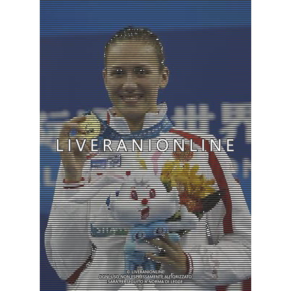 (110728) -- SHANGHAI, July 28, 2011 () -- Anastasia Zueva of Russia poses in the awarding ceremony of women\'s 50m backstroke swimming event at the 14th FINA World Championships in Shanghai, east China, July 28, 2011. Anastasia Zueva claimed the title with 27.79. (/Ren Long) (sqq)
