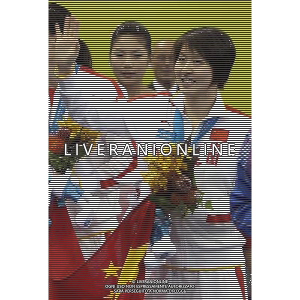 (110728) -- SHANGHAI, July 28, 2011 () -- Jiao Liuyang of China greets the public after the awarding ceremony of women\'s 200m butterfly swimming event at the 14th FINA World Championships in Shanghai, east China, July 28, 2011. Jiao Liuyang claimed the title with 2:05.55. (/Fan Jun) (sqq)