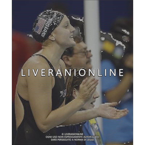 (110728) -- SHANGHAI, July 28, 2011 () -- Dagny Knutson of the United States applauds during the final of women\'s 4x200m freestyle swimming event at the 14th FINA World Championships in Shanghai, east China, July 28, 2011. The team of the United States claimed the title with 7:46.14. (/Fei Maohua) (zgp)