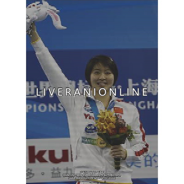 (110728) -- SHANGHAI, July 28, 2011 () -- Jiao Liuyang of China poses in the awarding ceremony of women\'s 200m butterfly swimming event at the 14th FINA World Championships in Shanghai, east China, July 28, 2011. Jiao Liuyang claimed the title with 2:05.55. (/Ren Long) (zgp)