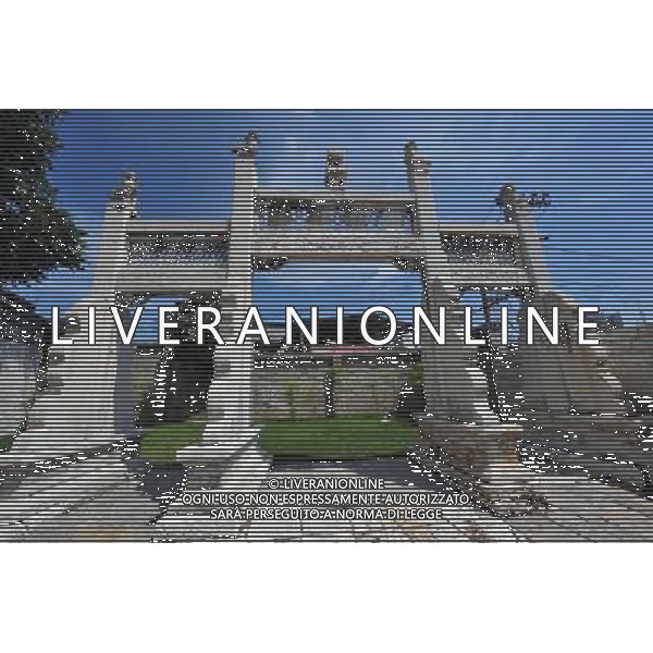 (110729) -- GUIYANG, Jul. 29, 2011 () -- Photo taken on July 27, 2011 shows the stone arch at the entrance of the Confucian Temple in Anshun, southwest China\'s Guizhou Province. The Confucian Temple, built around 1394 in Ming Dynasty and renovated several times afterwards, is one of the most delicate ones in China. It is constructed by stones and decorated with stone carvings. As the rare ancient stone buildings well kept till now, the temple attracts larger numbers of visitors every year. (/Yang Ying) (mp)
