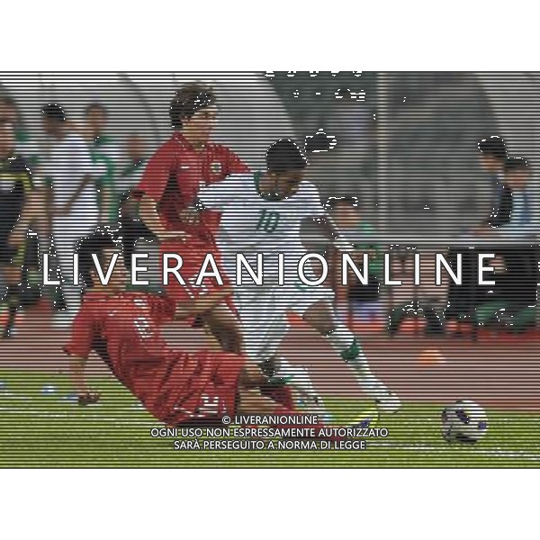 (110728) -- HONG KONG, July 28, 2011 () -- Lo Kwan Yee (bottom) of Hong Kong of China vies with Nawaf Shaker Alabid (R) of Saudi Arabia during the second round of Asian qualifying for the 2014 World Cup in Hong Kong, south China, July 28, 2011.Saudi Arabia defeated Hong Kong by 5-0. (/Lo Ping Fai)