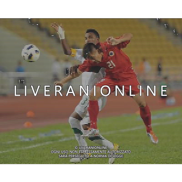 (110728) -- HONG KONG, July 28, 2011 () -- Kwok Kin Pong (R) of Hong Kong of China vies with Mohammed Mohammednoor Hawsawi of Saudi Arabia during the second round of Asian qualifying for the 2014 World Cup in Hong Kong, south China, July 28, 2011.Saudi Arabia defeated Hong Kong by 5-0. (/Lo Ping Fai)