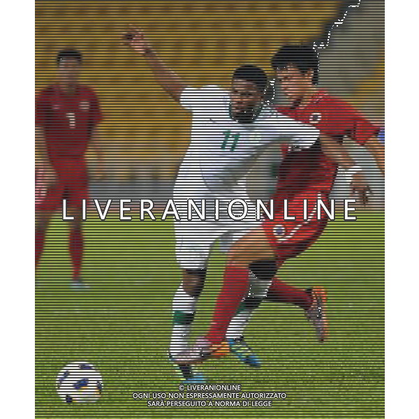 (110728) -- HONG KONG, July 28, 2011 () -- Leung Chun Pong (R) of Hong Kong of China vies with Nassir Ali Alshamrani of Saudi Arabia during their second round of Asian qualifier match for the 2014 World Cup in Hong Kong, south China, July 28, 2011. Saudi Arabia defeated Hong Kong by 5-0. (/Lo Ping Fai)