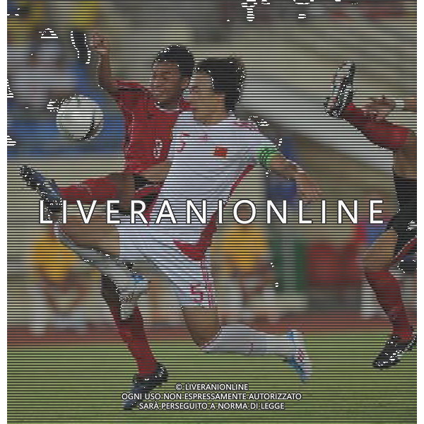 (110728) -- VIENTIANE, July 28, 2011 () -- Du Wei (R) of China vies for the ball against Souksavath of Laos during their qualifier match of the 2014 FIFA World Cup Brazil in Vientiane, capital of Laos, July 28, 2011. China won 6-1. (/Chen Xiaowei)