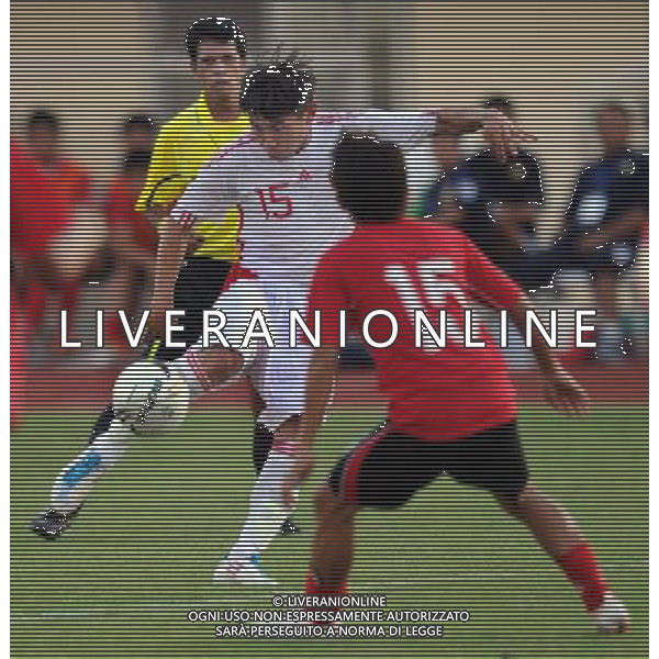 (110728) -- VIENTIANE, July 28, 2011 () -- Yu Hanchao (C) of China vies for the ball against Syphasay (R) of Laos during their qualifier match of the 2014 FIFA World Cup Brazil in Vientiane, capital of Laos, July 28, 2011. China won 6-1. (/Chen Xiaowei)