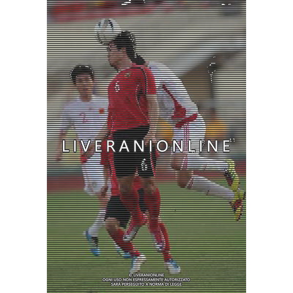 (110728) -- VIENTIANE, July 28, 2011 () -- Khamphg Sayavutthi (Front) of Laos heads the ball during the qualifier match of the 2014 FIFA World Cup Brazil against China in Vientiane, capital of Laos, July 28, 2011. China won 6-1. (/Chen Xiaowei)