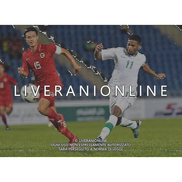 (110728) -- HONG KONG, July 28, 2011 () -- Nassir Ali Alshamrani (R) of Saudi Arabia shoots during the Asian qualifying for the 2014 World Cup with Hong Kong of China in Hong Kong, south China, July 28, 2011.Saudi Arabia defeated Hong Kong by 5-0. (/Lo Ping Fai)