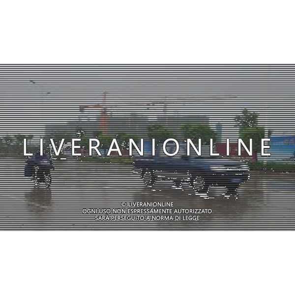 (110729) -- WENCHANG, July 29, 2011 () -- Photo taken on July 29, 2011 shows a block in the heavy rain caused by Nock-Ten in Wenchang City, south China\'s Hainan Province. Tropical storm Nock-Ten landed in coastal areas of Hainan Province on Friday afternoon. (/Wang Huiyu) (gsy)