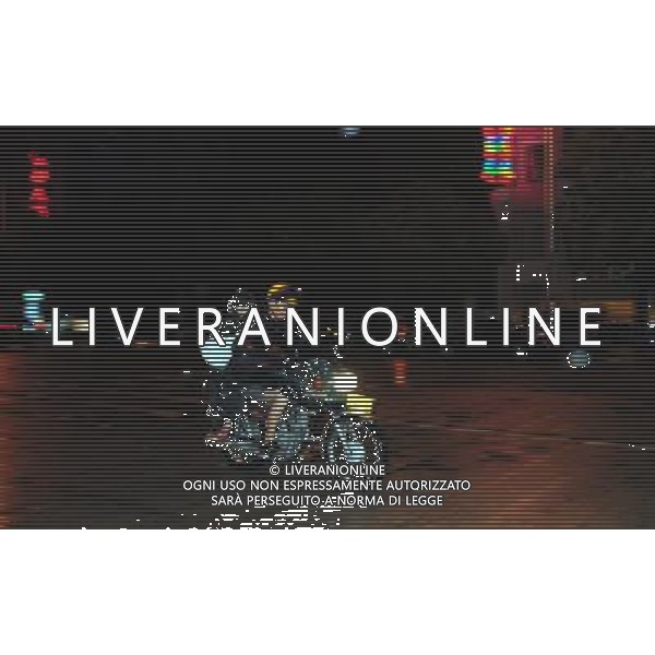 (110729) -- WENCHANG, July 29, 2011 () -- Local residents ride an autocycle in the rain caused by Nock-Ten in Wenchang City, south China\'s Hainan Province, July 29, 2011. Tropical storm Nock-Ten landed in coastal areas of Hainan Province on Friday afternoon. (/Wang Huiyu) (gsy)