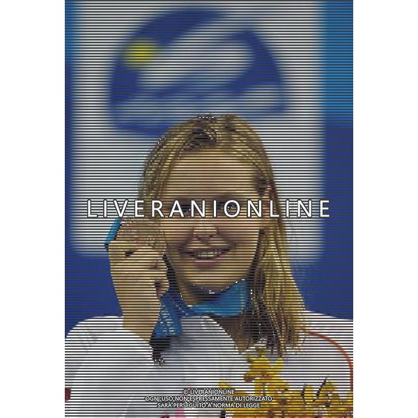(110730) -- SHANGHAI, July 30, 2011 () -- Sharon Van Rouwendaal of the Netherlands poses in the awarding ceremony of women\'s 200m backstroke swimming event at the 14th FINA World Championships in Shanghai, east China, July 30, 2011. Sharon Van Rouwendaal got the bronze medal with 2:07.78. (/Yang Zongyou) (sqq)