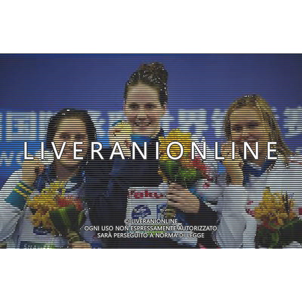 (110730) -- SHANGHAI, July 30, 2011 () -- Melissa Franklin (C) of the United States, Belinda Hocking (L) of Australia, Sharon Van Rouwendaal of the Netherlands pose in the awarding ceremony of women\'s 200m backstroke swimming event at the 14th FINA World Championships in Shanghai, east China, July 30, 2011. Melissa Franklin claimed the title with 2:05.10. Belinda Hocking won the silver medal with 2:06.06. Sharon Van Rouwendaal got the bronze medal with 2:07.78. (/Yang Zongyou) (sqq)