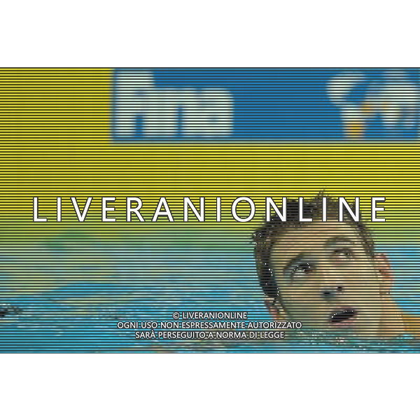 (110730) -- SHANGHAI, July 30, 2011 () -- Michael Phelps of the United States looks at the scoreboard after the final of men\'s 100m butterfly swimming event at the 14th FINA World Championships in Shanghai, east China, July 30, 2011. Michael Phelps claimed the title with 50.71. (/Yang Zongyou) (zgp)