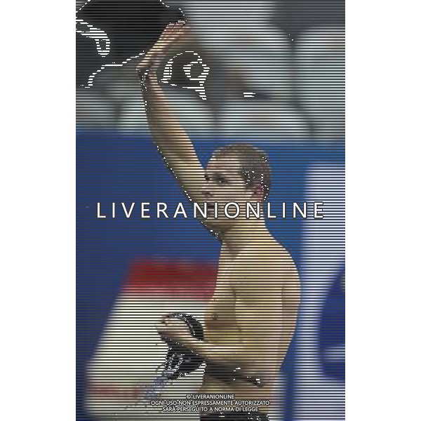 (110730) -- SHANGHAI, July 30, 2011 () -- Cesar Cielo Filho of Brazil waves to spectators after the final of men\'s 50m freestyle swimming event at the 14th FINA World Championships in Shanghai, east China, July 30, 2011. Cesar Cielo Filho of Brazil claimed the title with 21.52. (/Fan Jun) (zgp)