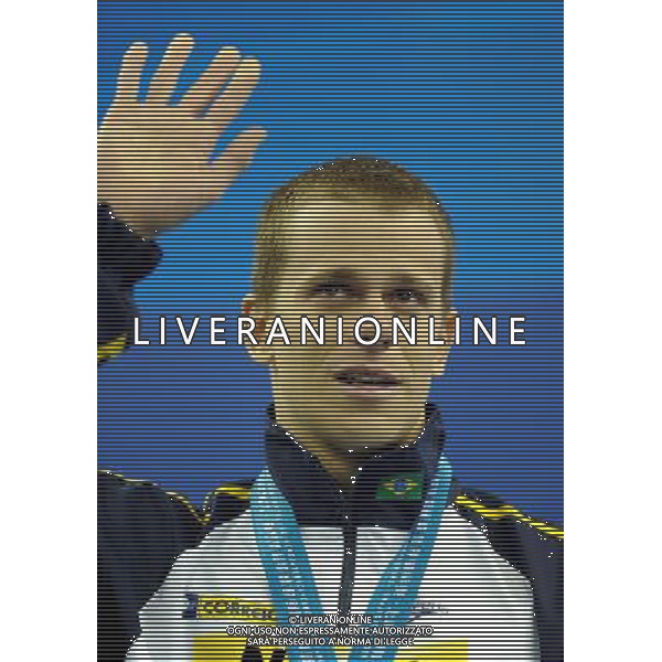 (110730) -- SHANGHAI, July 30, 2011 () -- Cesar Cielo Filho of Brazil poses in the awarding ceremony of men\'s 50m freestyle swimming event at the 14th FINA World Championships in Shanghai, east China, July 30, 2011. Cesar Cielo Filho claimed the title with 21.52. (/Yang Zongyou) (sqq)
