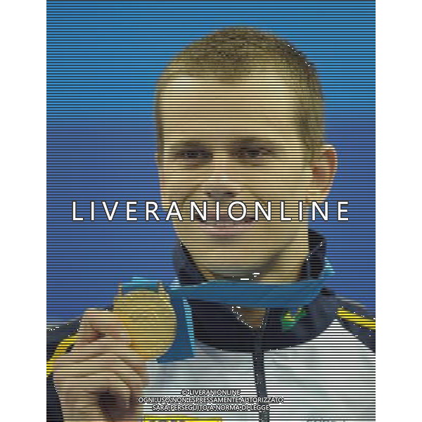 (110730) -- SHANGHAI, July 30, 2011 () -- Cesar Cielo Filho of Brazil poses in the awarding ceremony of men\'s 50m freestyle swimming event at the 14th FINA World Championships in Shanghai, east China, July 30, 2011. Cesar Cielo Filho claimed the title with 21.52. (/Yang Zongyou) (sqq)