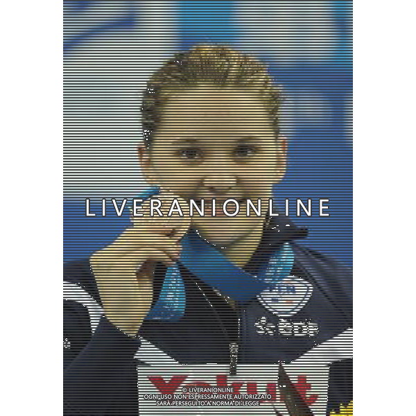 (110730) -- SHANGHAI, July 30, 2011 () ®C- Melanie Henique of France poses in the awarding ceremony of women\'s 50m butterfly swimming event at the 14th FINA World Championships in Shanghai, east China, July 30, 2011. Melanie Henique got the bronze medal with 25.86. (/Yang Zongyou) (sqq)