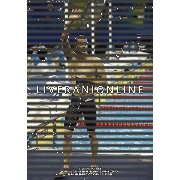 (110730) -- SHANGHAI, July 30, 2011 () -- Cesar Cielo Filho of Brazil waves to spectators after the final of men\'s 50m freestyle swimming event at the 14th FINA World Championships in Shanghai, east China, July 30, 2011. Cesar Cielo Filho of Brazil claimed the title with 21.52. (/Fei Maohua) (zgp)