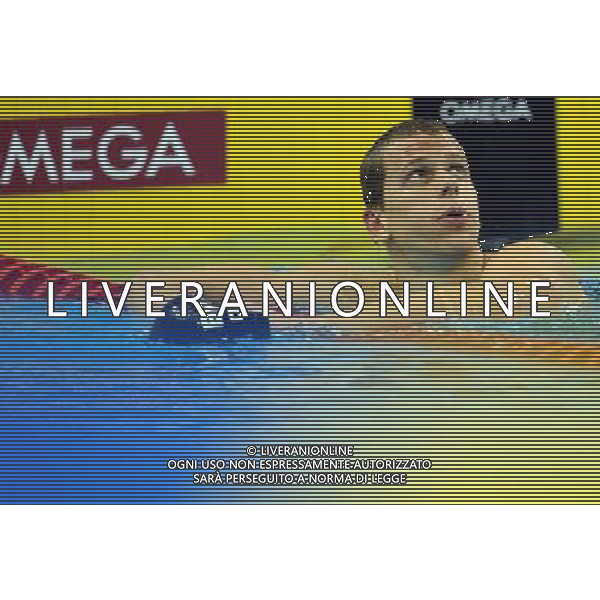 (110730) -- SHANGHAI, July 30, 2011 () -- Cesar Cielo Filho of Brazil looks at the scoreboard after the final of men\'s 50m freestyle swimming event at the 14th FINA World Championships in Shanghai, east China, July 30, 2011. Cesar Cielo Filho of Brazil claimed the title with 21.52. (/Yang Zongyou) (zgp)