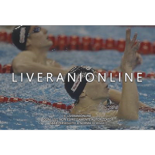 (110730) -- SHANGHAI, July 30, 2011 () -- Cesar Cielo Filho (R) of Brazil celebrates after the final of men\'s 50m freestyle swimming event at the 14th FINA World Championships in Shanghai, east China, July 30, 2011. Cesar Cielo Filho of Brazil claimed the title with 21.52. (/Fei Maohua) (zgp)
