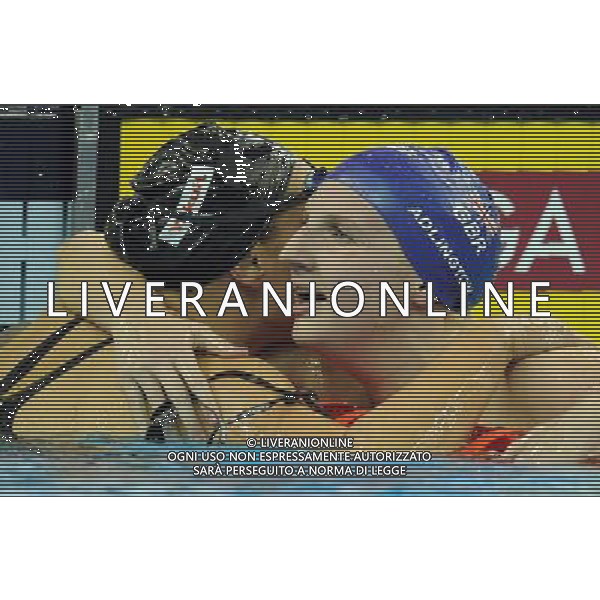 (110730) -- SHANGHAI, July 30, 2011 () -- Rebecca Adlington (R) of Britain receives congratulations after the final of women\'s 800m freestyle swimming event at the 14th FINA World Championships in Shanghai, east China, July 30, 2011. Rebecca Adlington of Britain claimed the title with 8:17.51. (/Yang Zongyou)