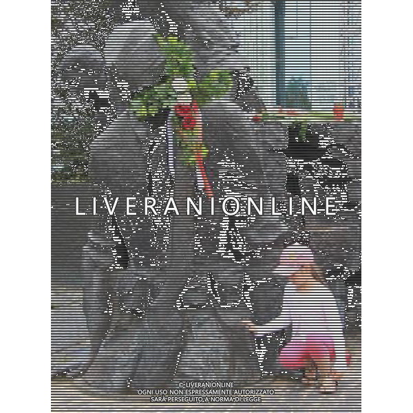 (110801) -- WARSAW, Aug. 01, 2011 () -- A girl pays her homage to the victims in Warsaw Uprising in front of the Warsaw Uprising Monument in Warsaw, Poland on August 1, 2011. Poland started to commemorate the 67th anniversary of Warsaw Uprising of Polish Home Army partisans against Nazi occupation since July 31. (/Gao Fan) (srb)