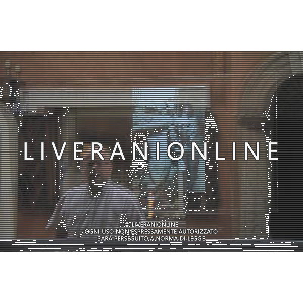 (110801) -- WARSAW, Aug. 01, 2011 () -- A passer-by watches a film about Warsaw Uprising through the window of a shop in Warsaw, capital of Poland on August 1, 2011. Poland started to commemorate the 67th anniversary of Warsaw Uprising of Polish Home Army partisans against Nazi occupation since July 31.(/Gao Fan) (srb)