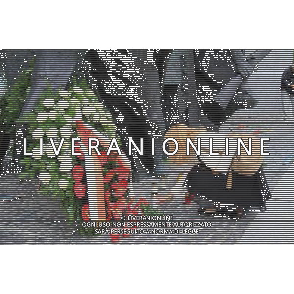 (110801) -- WARSAW, Aug. 01, 2011 () -- A local citizen mourns the victims in Warsaw Uprising in front of the Warsaw Uprising Monument in Warsaw, Poland on August 1, 2011. Poland started to commemorate the 67th anniversary of Warsaw Uprising of Polish Home Army partisans against Nazi occupation since July 31. (/Gao Fan) (srb)